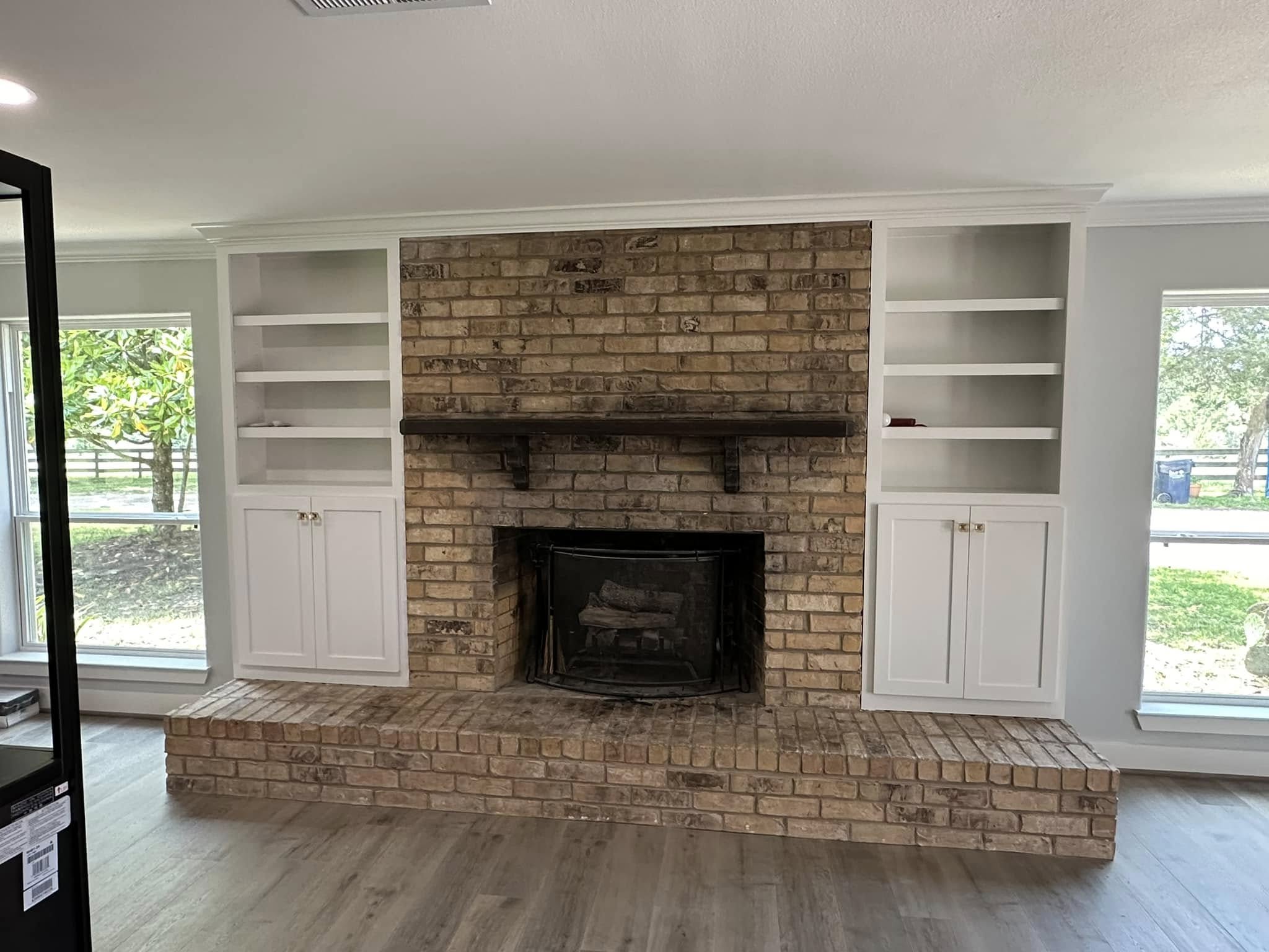 Fireplace wall with custom built-in shelving